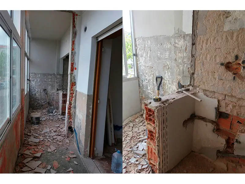 Interior en obras con revestimientos demolidos, rozas abiertas y escombros